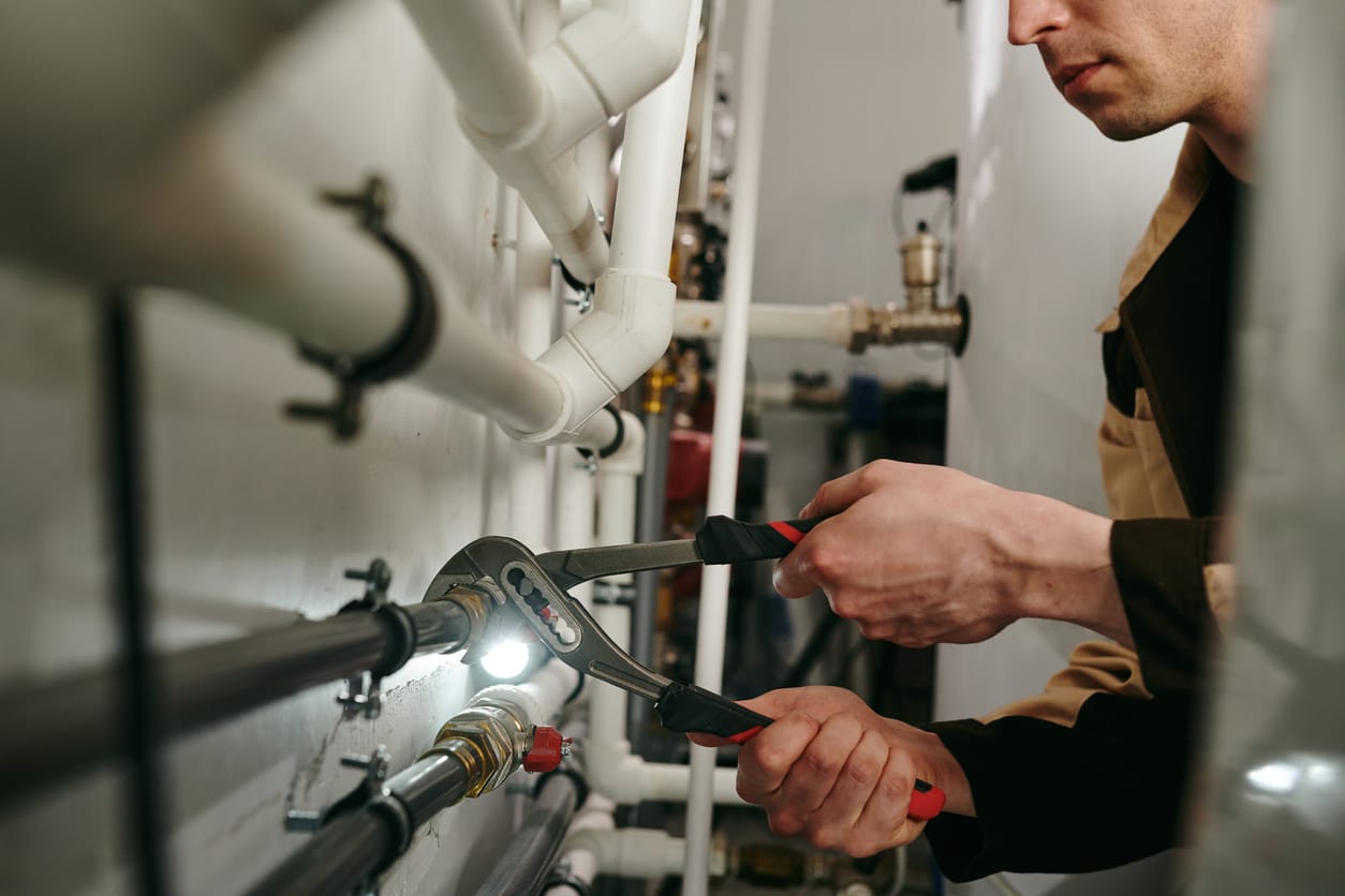 Plumbers maintaining commercial plumbing pipes in Lebanon