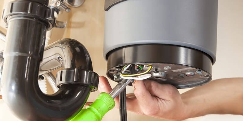Technician repairing the heating element of a water heater in Lebanon